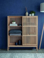 Linear Large Storage Cabinet. Natural ash cabinet. Sliding door storage unit. Modern storage cabinet. Vertical line cabinet. Minimalist storage furniture. Exposed shelving cabinet. Contemporary storage unit. Living room cabinet. Dining room storage. Home office storage. Scandinavian style cabinet. Modern wood cabinet. Tall storage unit. Functional home storage.