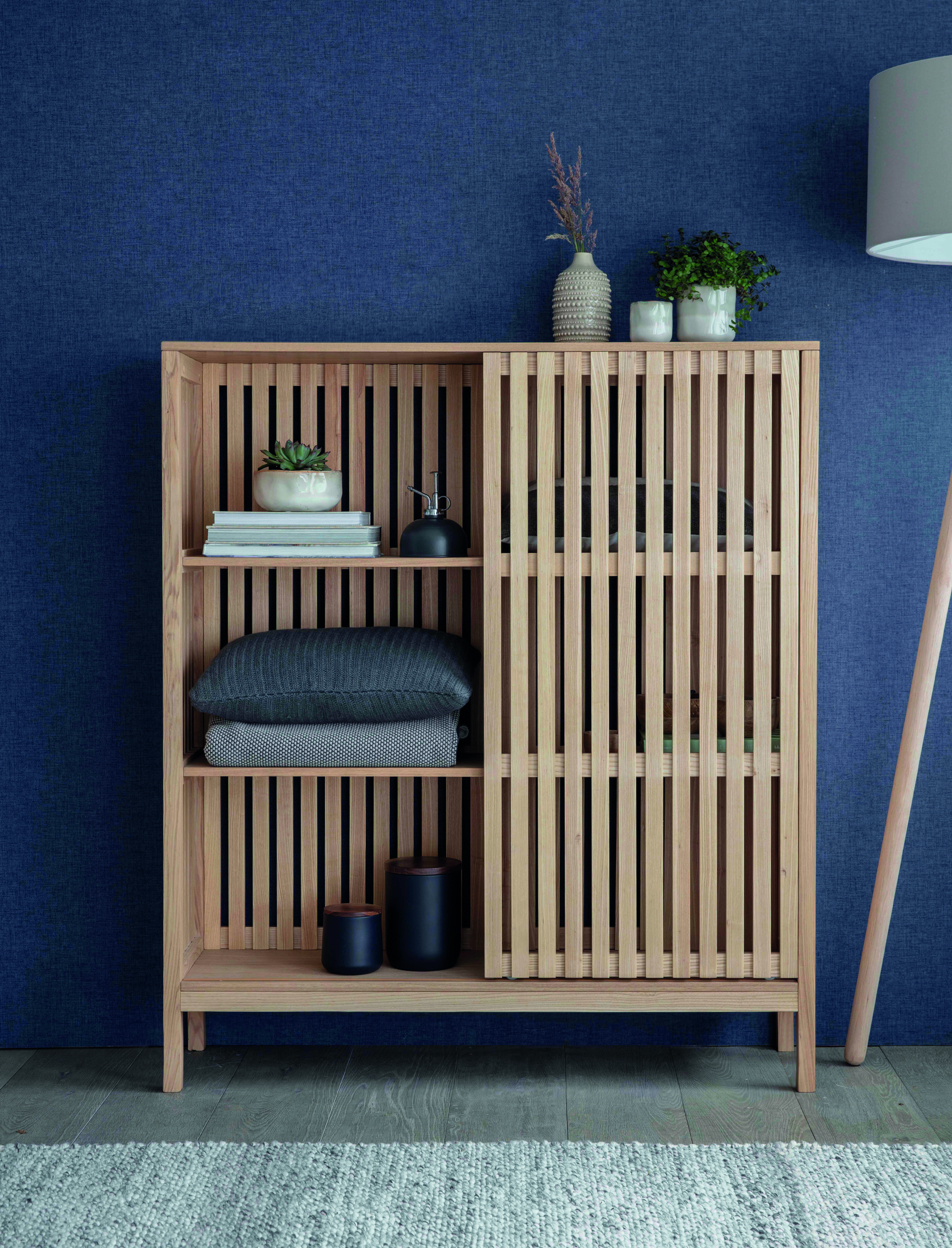 Linear Large Storage Cabinet Linear Large Storage Cabinet. Natural ash cabinet. Sliding door storage unit. Modern storage cabinet. Vertical line cabinet. Minimalist storage furniture. Exposed shelving cabinet. Contemporary storage unit. Living room cabinet. Dining room storage. Home office storage. Scandinavian style cabinet. Modern wood cabinet. Tall storage unit. Functional home storage.