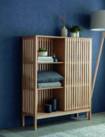 Linear Large Storage Cabinet. Natural ash cabinet. Sliding door storage unit. Modern storage cabinet. Vertical line cabinet. Minimalist storage furniture. Exposed shelving cabinet. Contemporary storage unit. Living room cabinet. Dining room storage. Home office storage. Scandinavian style cabinet. Modern wood cabinet. Tall storage unit. Functional home storage.