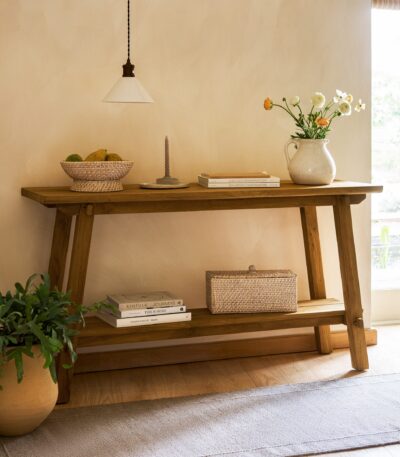 Hanborough Console Table. Recycled teak console table. Live edge console table. Rustic hallway table. Wooden console table. Trestle style table. Natural wood console. Sustainable furniture. Modern rustic furniture. Entryway console table. Teak wood furniture. Handcrafted console table. Hallway storage table. Lower shelf console table. Warm wood furniture.