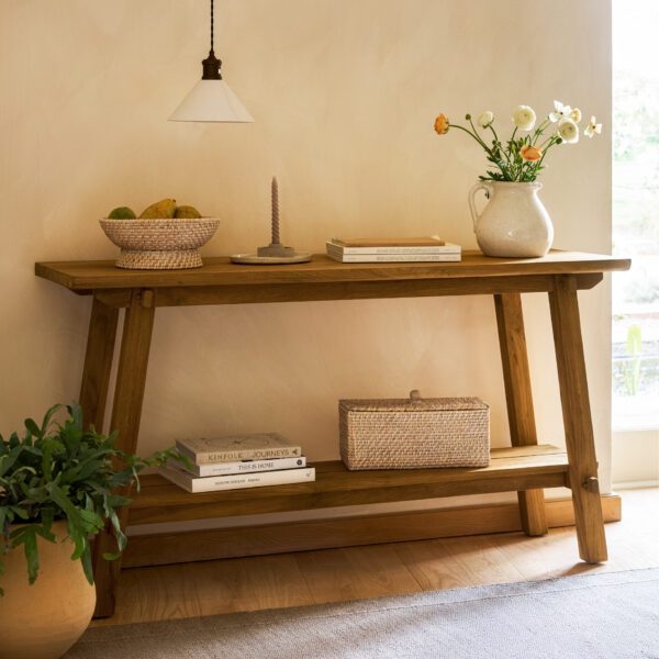 Hanborough Console Table. Recycled teak console table. Live edge console table. Rustic hallway table. Wooden console table. Trestle style table. Natural wood console. Sustainable furniture. Modern rustic furniture. Entryway console table. Teak wood furniture. Handcrafted console table. Hallway storage table. Lower shelf console table. Warm wood furniture.