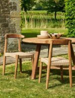 Hawthorne Set of 2 Dining Chairs. Reclaimed teak dining chairs. Teak and hyacinth chairs. Indoor outdoor dining chairs. Rustic wooden chairs. Sustainable dining furniture. Indonesian teak chairs. Natural woven seat chairs. Farmhouse dining chairs. Rustic dining room seating. Patio dining chairs. Eco-friendly furniture. Teak chair set. Weatherproof teak chairs. Handcrafted dining chairs.